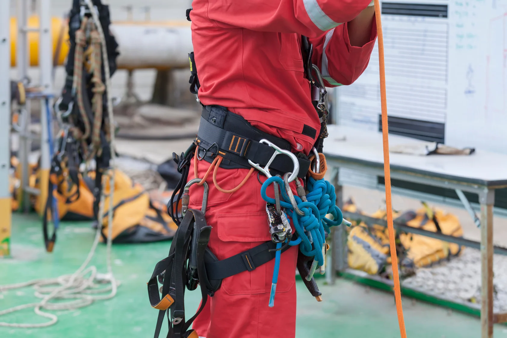 Inspector man wearing rope access equipment